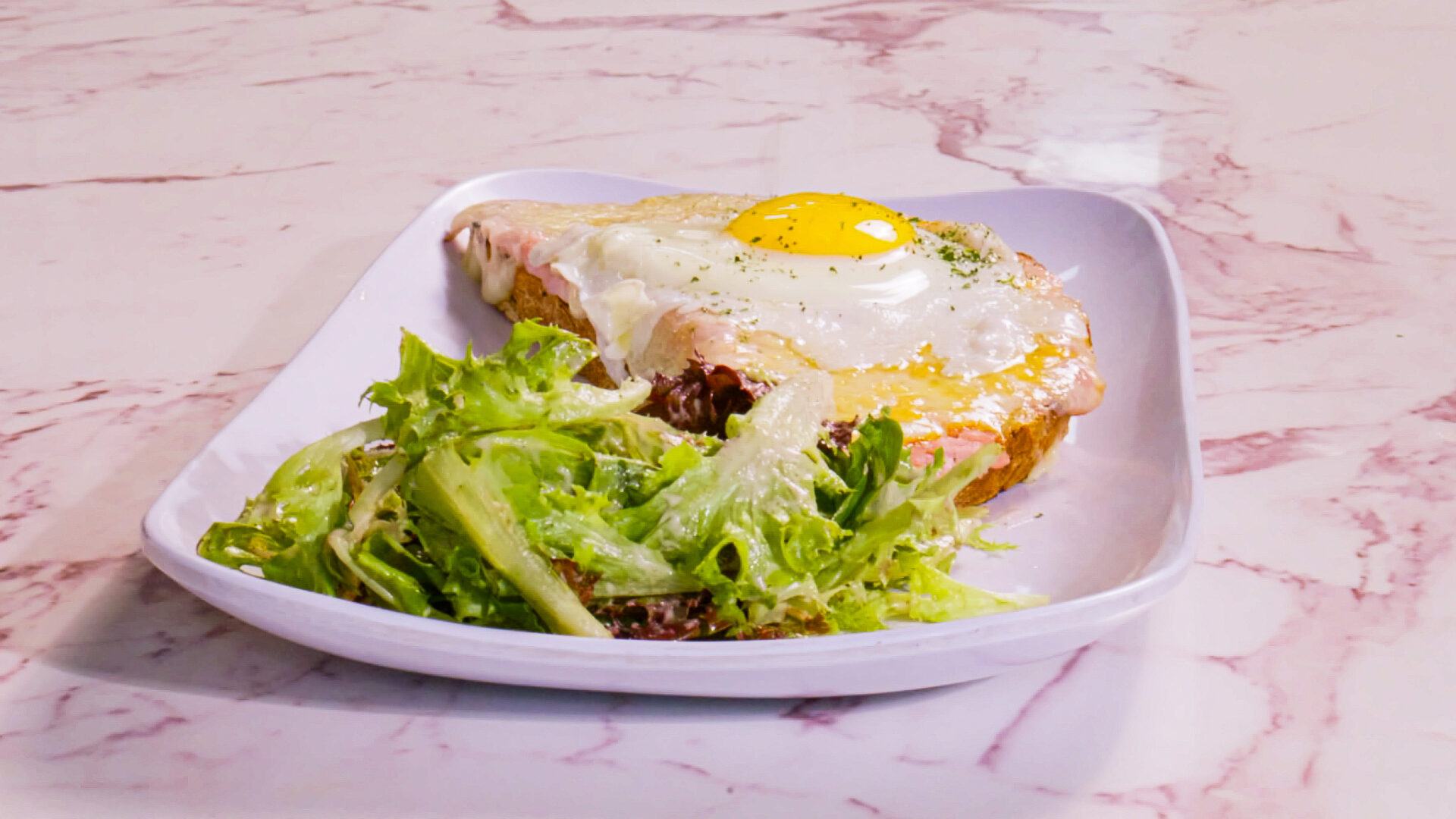 Croque tartine topped with a fried egg at French Press Bakery Needham MA