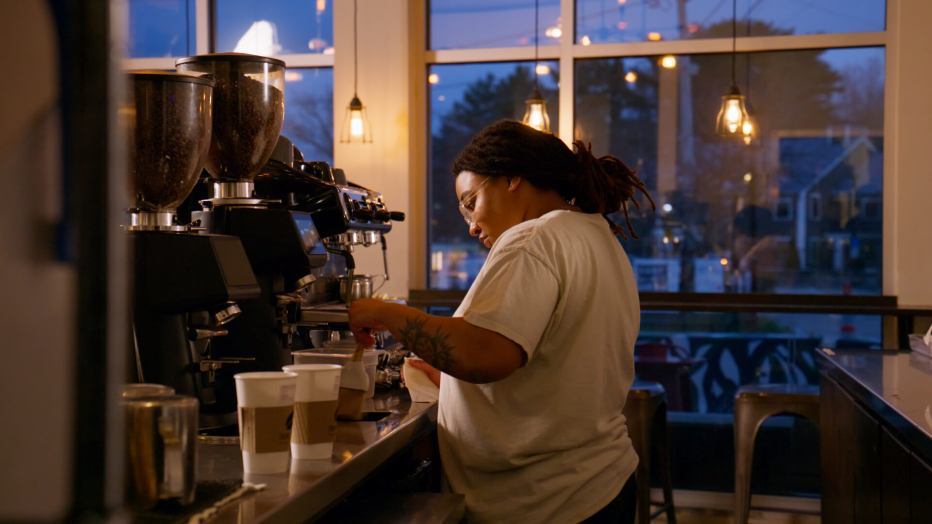 Barista preparing coffee to-go orders at French Press Bakery Needham MA