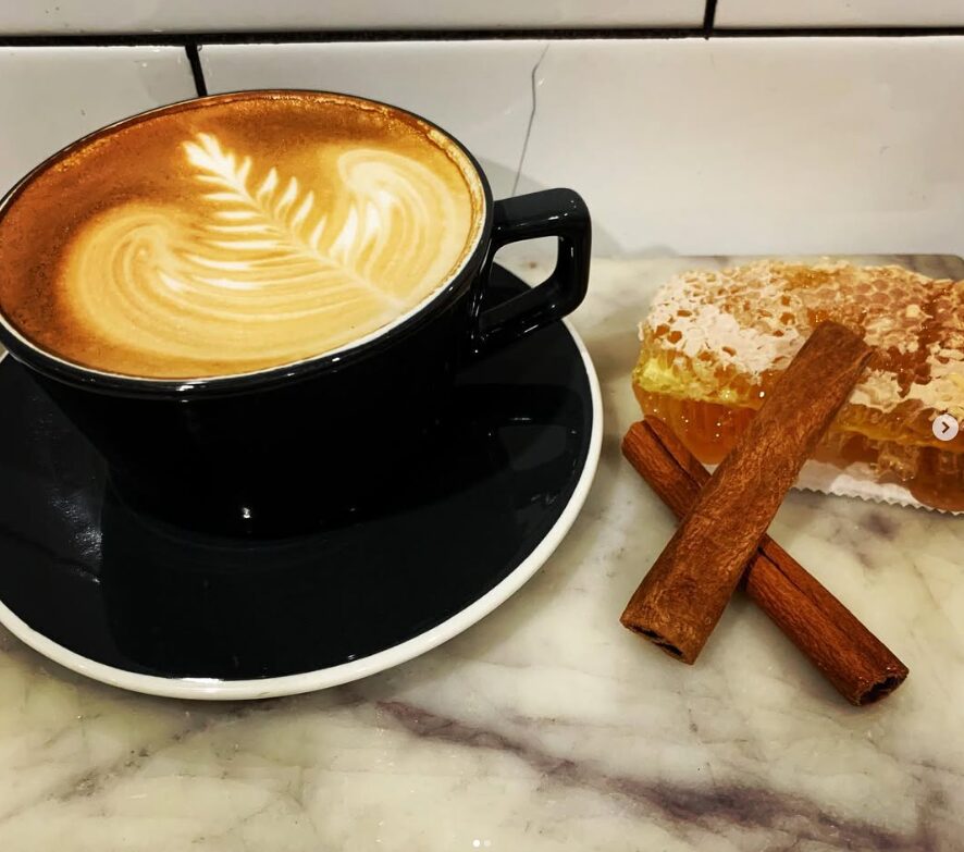 Latte with foam art and pastry pairing at French Press Bakery Needham MA