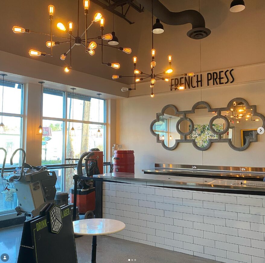 Bright café interior at French Press Bakery Needham MA in the morning